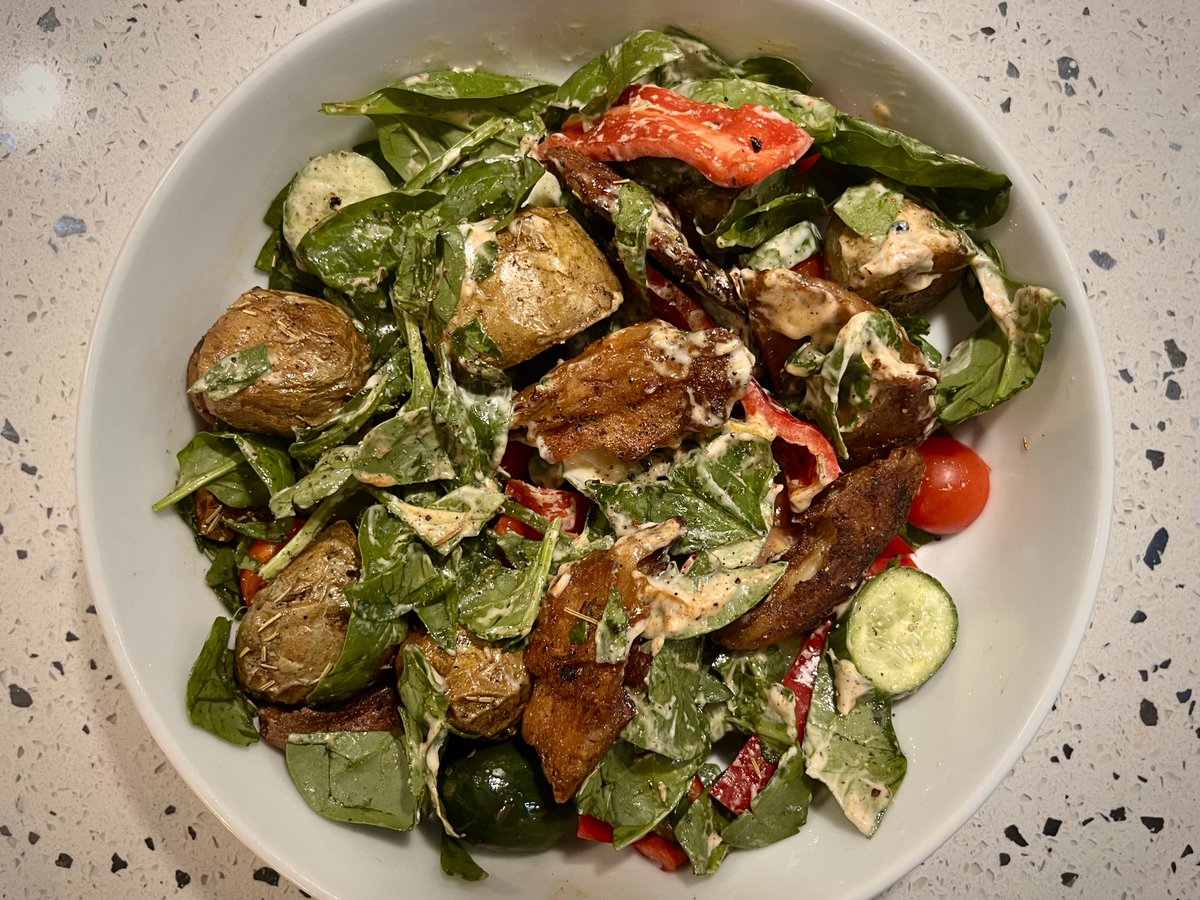 Hot summer night dinner for one: roasted new potatoes and fake grilled chicken cooked in garlic &amp; cajun spices, plus salad, and all tossed in vegan garlic mayo blended with more spice. Tip-top 😋