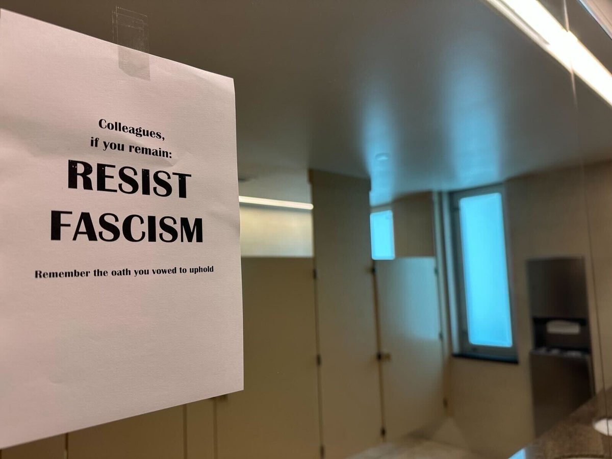 A State Department employee shared with PBS News an image from inside the department. The image includes a piece of paper taped to a mirror with the words, "Colleagues, if you remain: RESIST FASCISM. Remember the oath you vowed to uphold."

The State Department is firing around