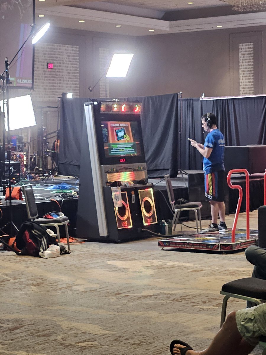 IndigoZephyrous's tweet photo. With the #Balatro run complete, runners are setting up for #PumpItUpPhoenix with the actual arcade cabinet at #SummerGamesDoneQuick #SGDQ2025 #GameDineQuick! @gamesdonequick ! #Twitch #LGBTQIA https://t.co/FphX9xWajz