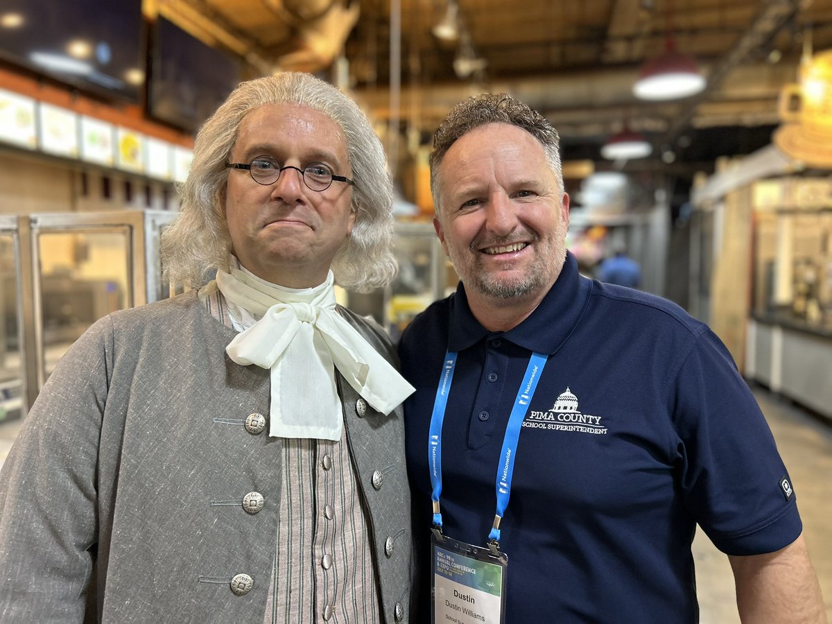 Our President <a href="/thesuperteacher/">Dustin J. Williams 📚</a> and Mr. Ben Franklin hanging out at the <a href="/NACoTweets/">NACo</a> Opening Reception at the Philly Reading Market.