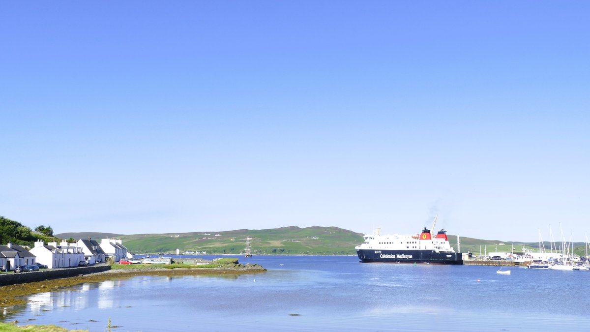 Lovely morning in Port Ellen with the TS SHTANDART anchored in the bay as the Finlaggan was arriving .