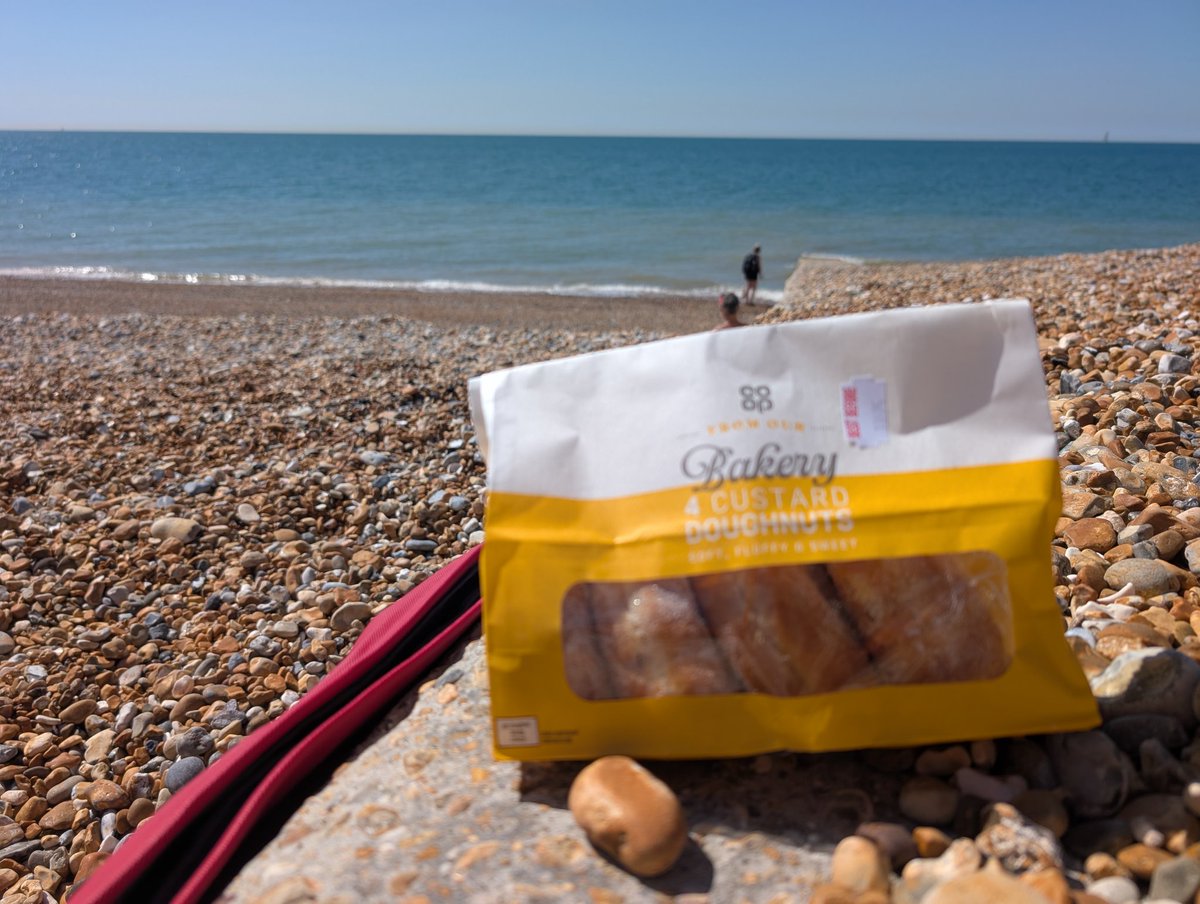 Custard doughnuts on the beach. Maybe a sploosh in the sea first