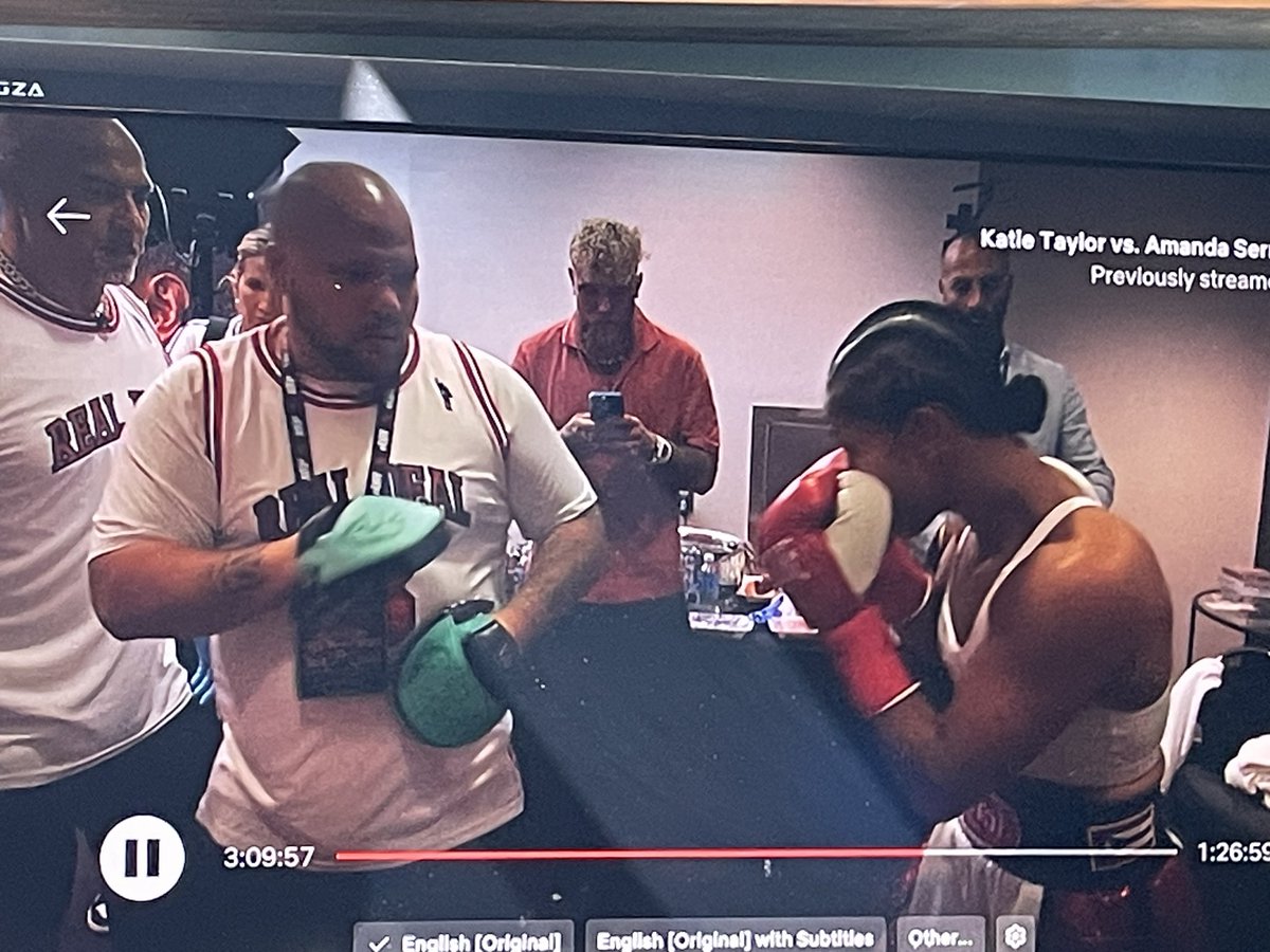 The modern world in one photograph. <a href="/jakepaul/">Jake Paul</a> glued to his phone as one of the great warriors of boxing gets ready for her entrance. How many of us would love that privilege of witnessing those moments in Madison Square Garden? I give up.