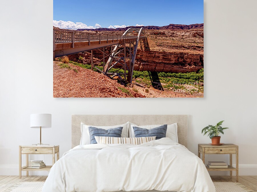 This photograph offers a close-up view of the iconic Hite Crossing Bridge as it arches over the Colorado River in the remote desert landscape of southern Utah <a href="/FineArtAmerica/">Fine Art America</a> 
5-jennifer-white.pixels.com/featured/besid…
#photography #buyintoart #travelphotography