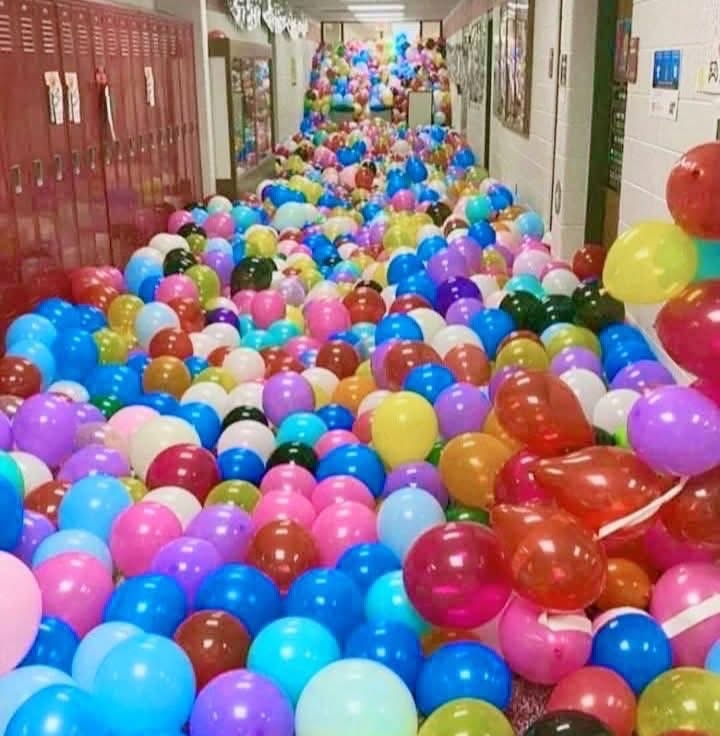 A teacher gave each student a balloon, who had to inflate it, write their name on it, and throw it down the hall. The teacher then mixed up all the balloons. The students were given 5 minutes to find their own balloons. 

Despite the frantic search, no one found their balloon.
At