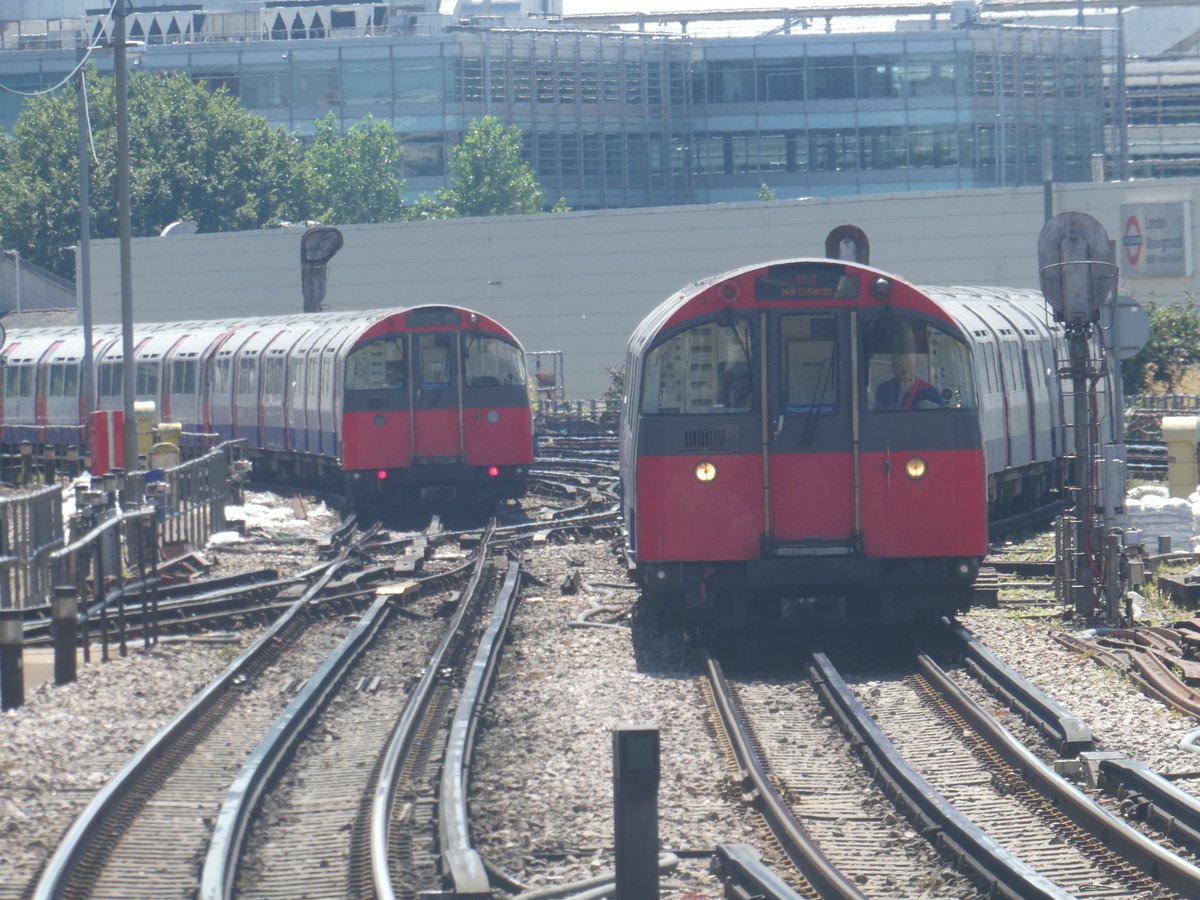 JRailVolunteer's tweet image. A pair of Piccadilly Line 1973 stock trains at Acton Town, the train on the left was working a Uxbridge to Cockfosters service and train 357 was working a service to Northfields.