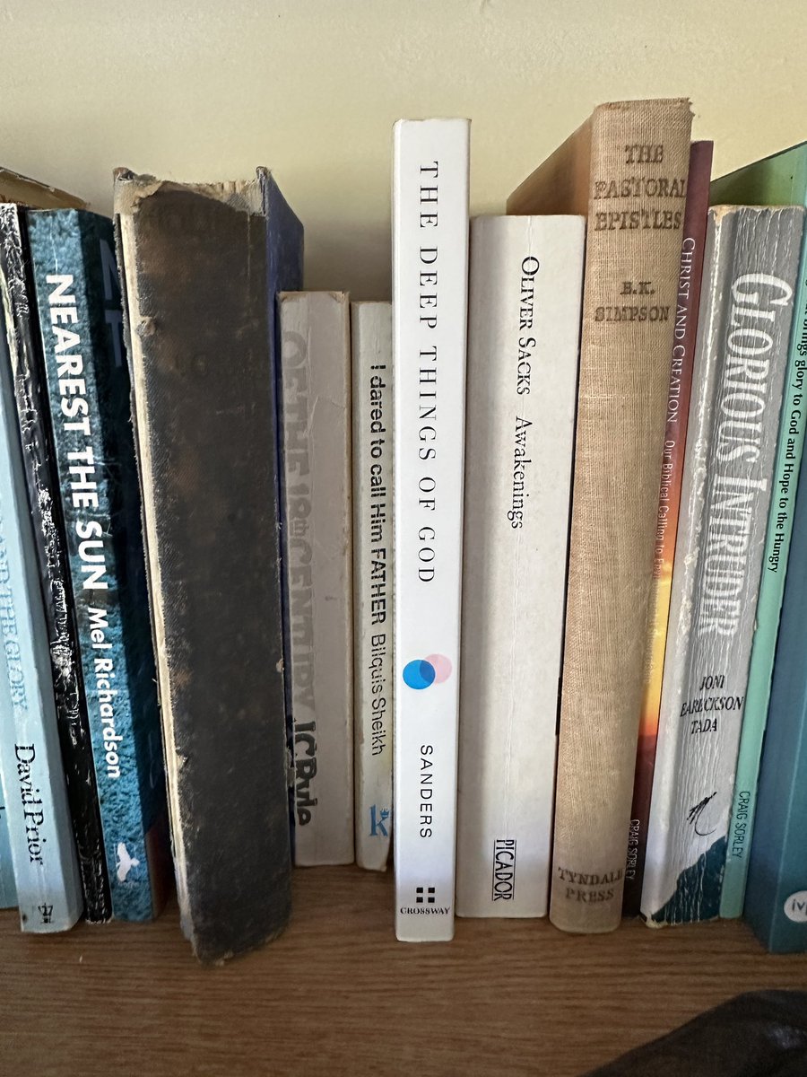 TheJustinSchell's tweet image. At John Stott’s writing retreat “The Hookses,” and saw @FredFredSanders in the bookshelf.