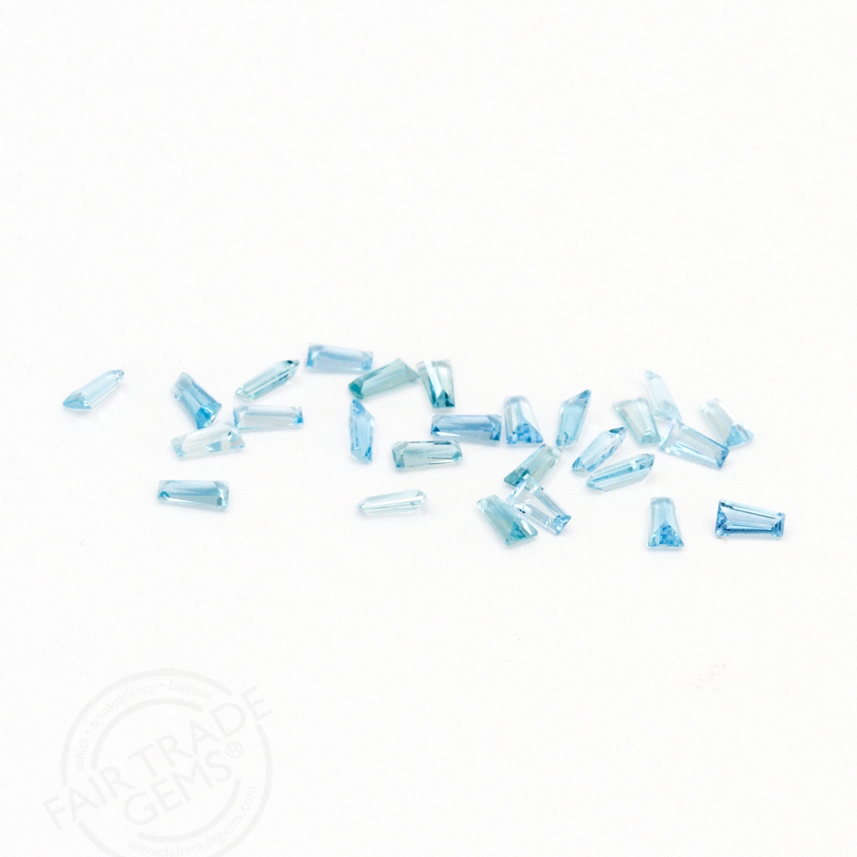 These delicate 3x1.5x1mm Aquamarine Tapered Baguettes are like crystal-clear waves on a sunlit shore—cool, serene, and effortlessly elegant. Perfect for capturing that endless-summer feeling in any jewelry design, these gems bring a refreshing splash of blue to the season.⁠