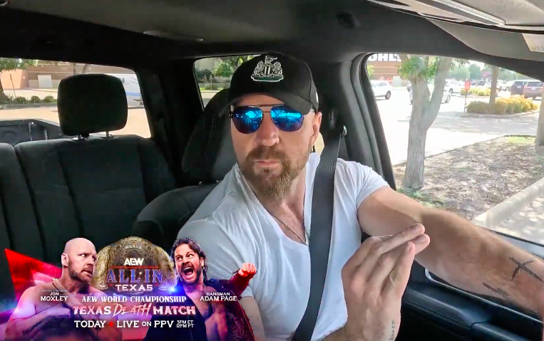 WrestleTalk_TV's tweet photo. AEW World Champion Jon Moxley with the Newcastle United hat ⚽️ https://t.co/y7sSStsfL1
