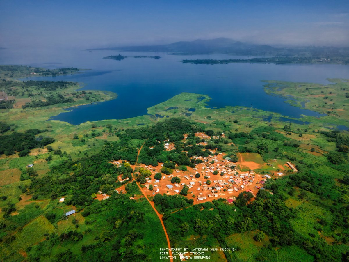 iQueiku's tweet photo. When I turned my drone on, I knew the view would be spectacular, but I didn't know this was the surprise that awaited me. Nkonya Wurupong (#Ghana) glows like the heart of the continent, cloaked in a #sunset only the ancestors could pain https://t.co/m3jYOGL274