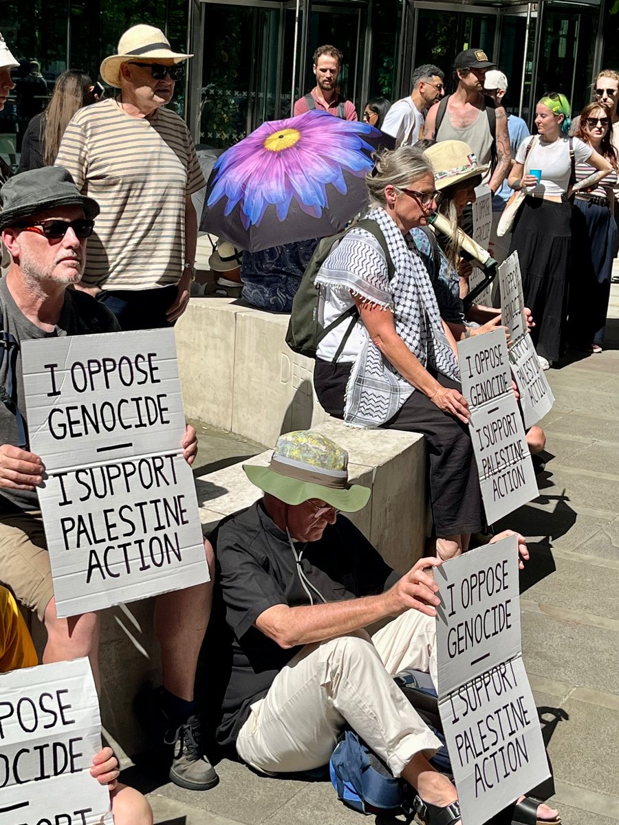 InvisibleMapper's tweet image. In Manchester police push through crowds + arrest 16 people inc 3 vicars and many elderly under the Terrorism Act for holding signs "I oppose genocide. I support Palestine Action"