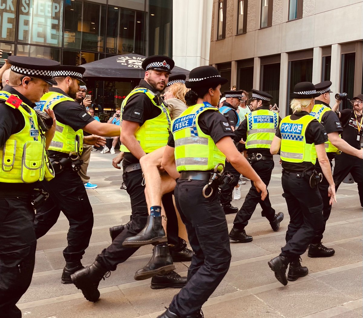InvisibleMapper's tweet image. In Manchester police push through crowds + arrest 16 people inc 3 vicars and many elderly under the Terrorism Act for holding signs "I oppose genocide. I support Palestine Action"