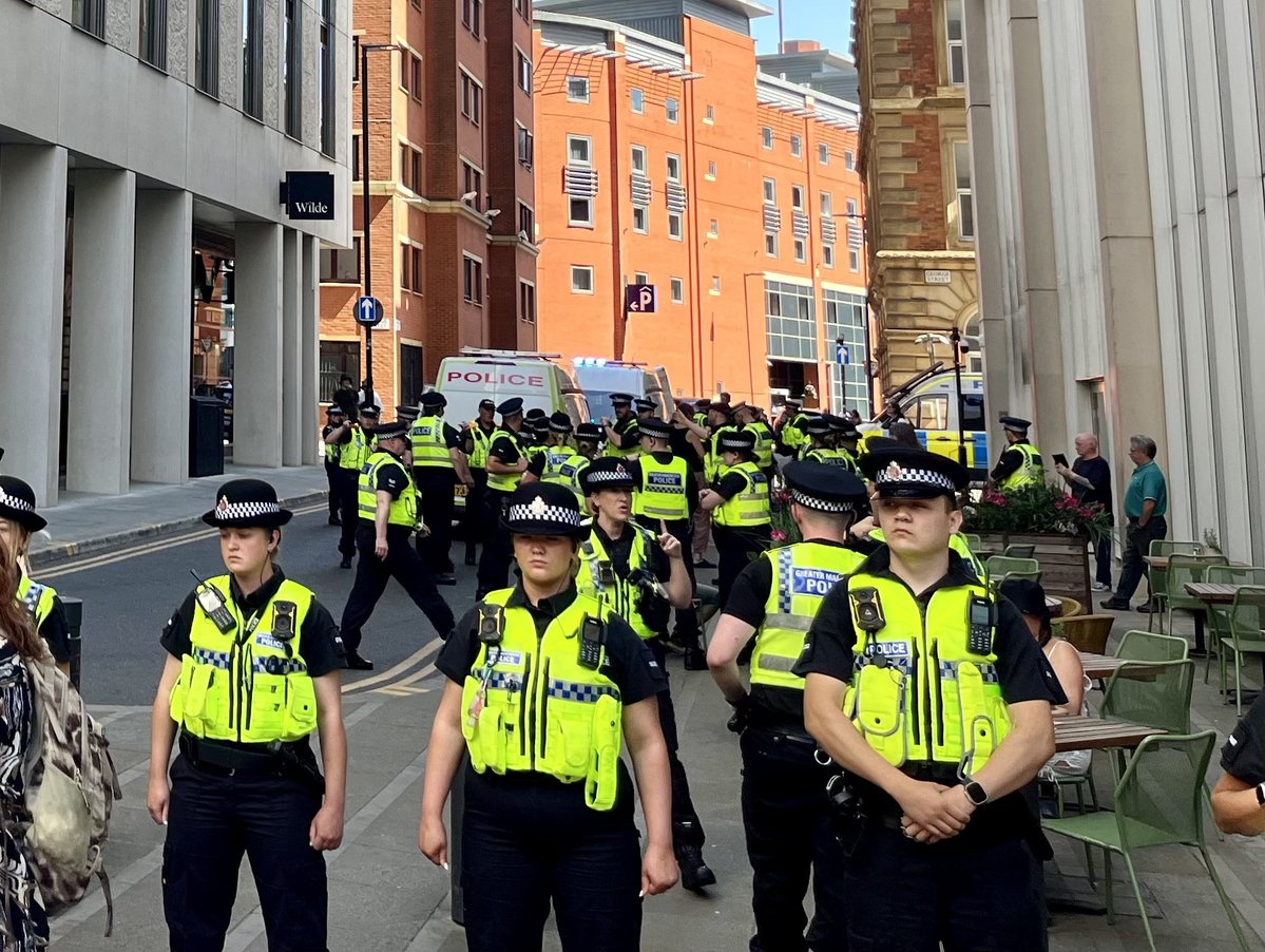 InvisibleMapper's tweet image. In Manchester police push through crowds + arrest 16 people inc 3 vicars and many elderly under the Terrorism Act for holding signs "I oppose genocide. I support Palestine Action"