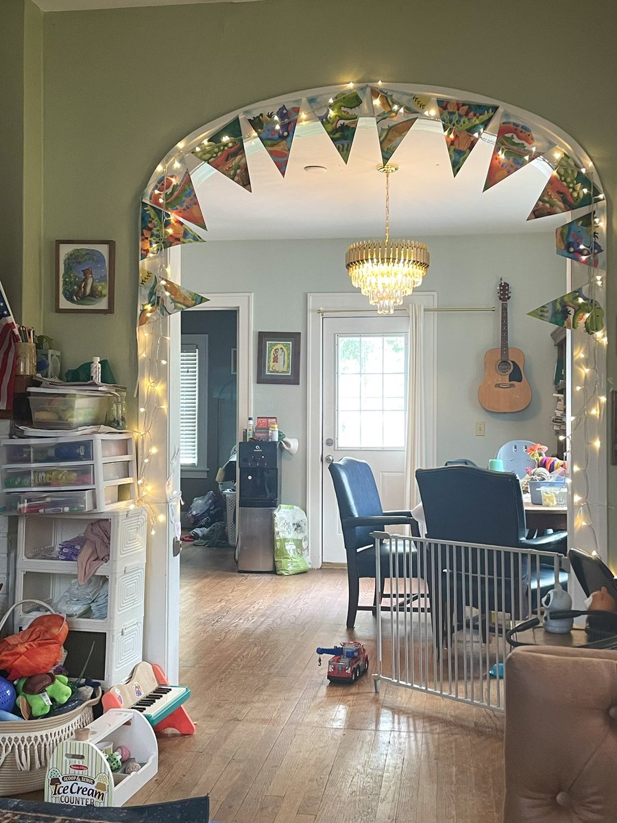 racheljwelcher's tweet image. Dinosaur banner and Christmas lights, because it’s not just our home, but our kids’ home, too. ❤️🦖🦕