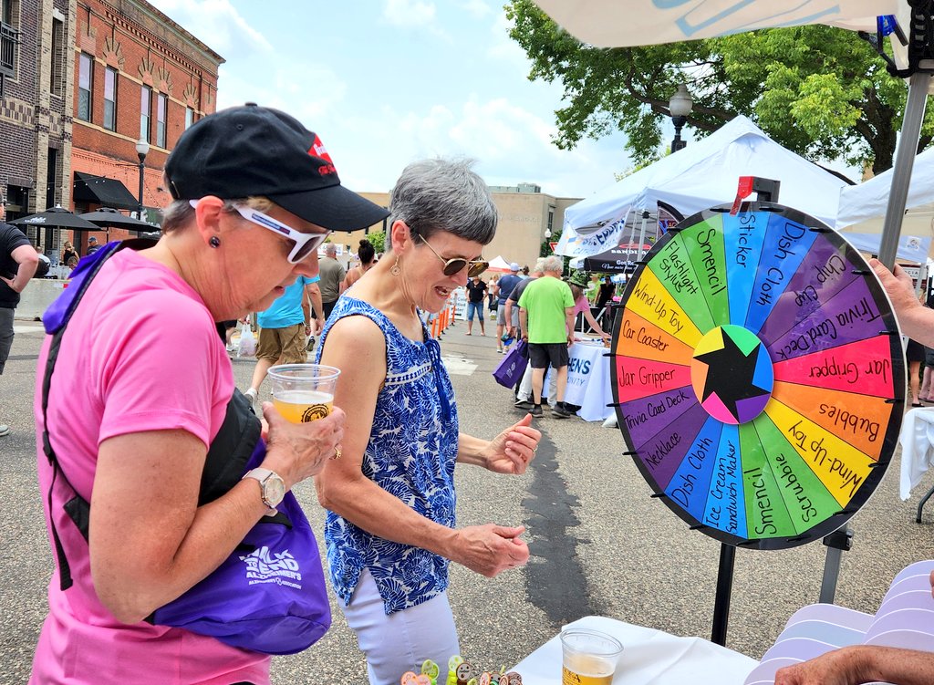 Anoka Riverfest day! <a href="/barb_rule/">Barb Rule</a> and aunt Kathleen stopped at our Zion Lutheran Church booth to spin the prize wheel.