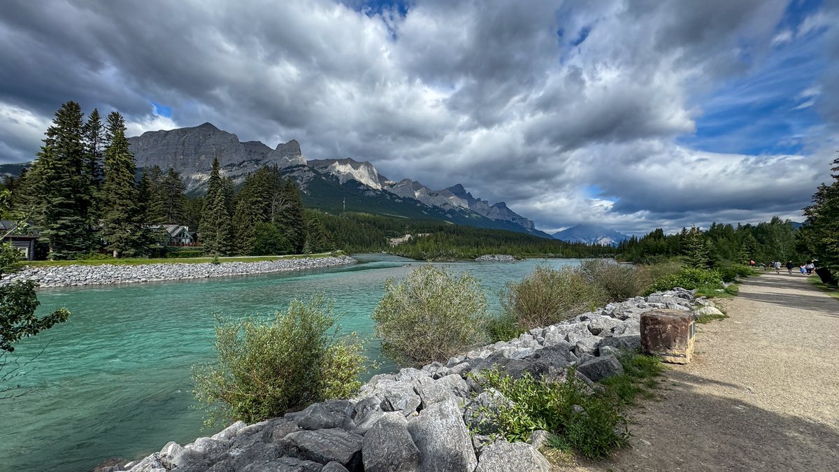 It was cloudy &amp; breezy today. Fewer clouds in the PM. 25C. #canmore #ShareYourWeather #abstorm Seagull Isle has re-emerged from th Bow River (no gulls). I wish I knew that plant’s name that survives being underwater for months. I’d wade over there but th channel is deep and cold!