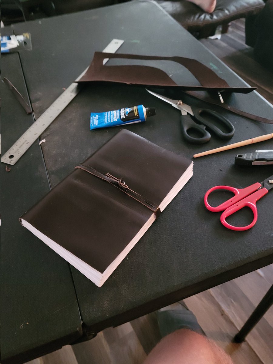 I made my own leather bound journal today with my birthday money from my grandma...

I might make another one because I kinda messed up a little on this one...