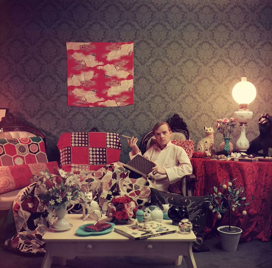 Truman Capote at home in his Brooklyn Heights apartment, 1958 • Slim Aarons •