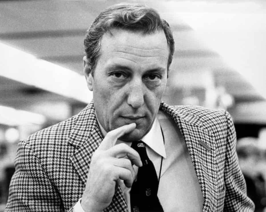 As a journalist , X covered the Biafran war in Nigeria, but still had no money or prospects

Against friends advice, X decided to write a novel Y in 1971 &amp; completed it in just 35 days

The novel , a great read , sold over 10 million copies

Identify X and Y

#visualquizwithkmp