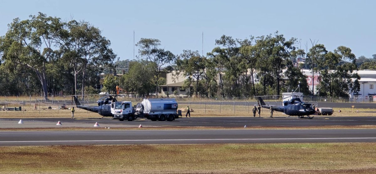 A quick phone photo showing a pair of <a href="/RCAF_ARC/">Royal Canadian Air Force</a> Royal Canadian Air Force (RCAF) Bell CH-146 Griffon (EP412) helicopters on the ground at #Gladstone Airport.

They are reportedly heading from RAAF Base Richmond in to Townsville for Exercise Talisman Sabre 2025 (#TS25).