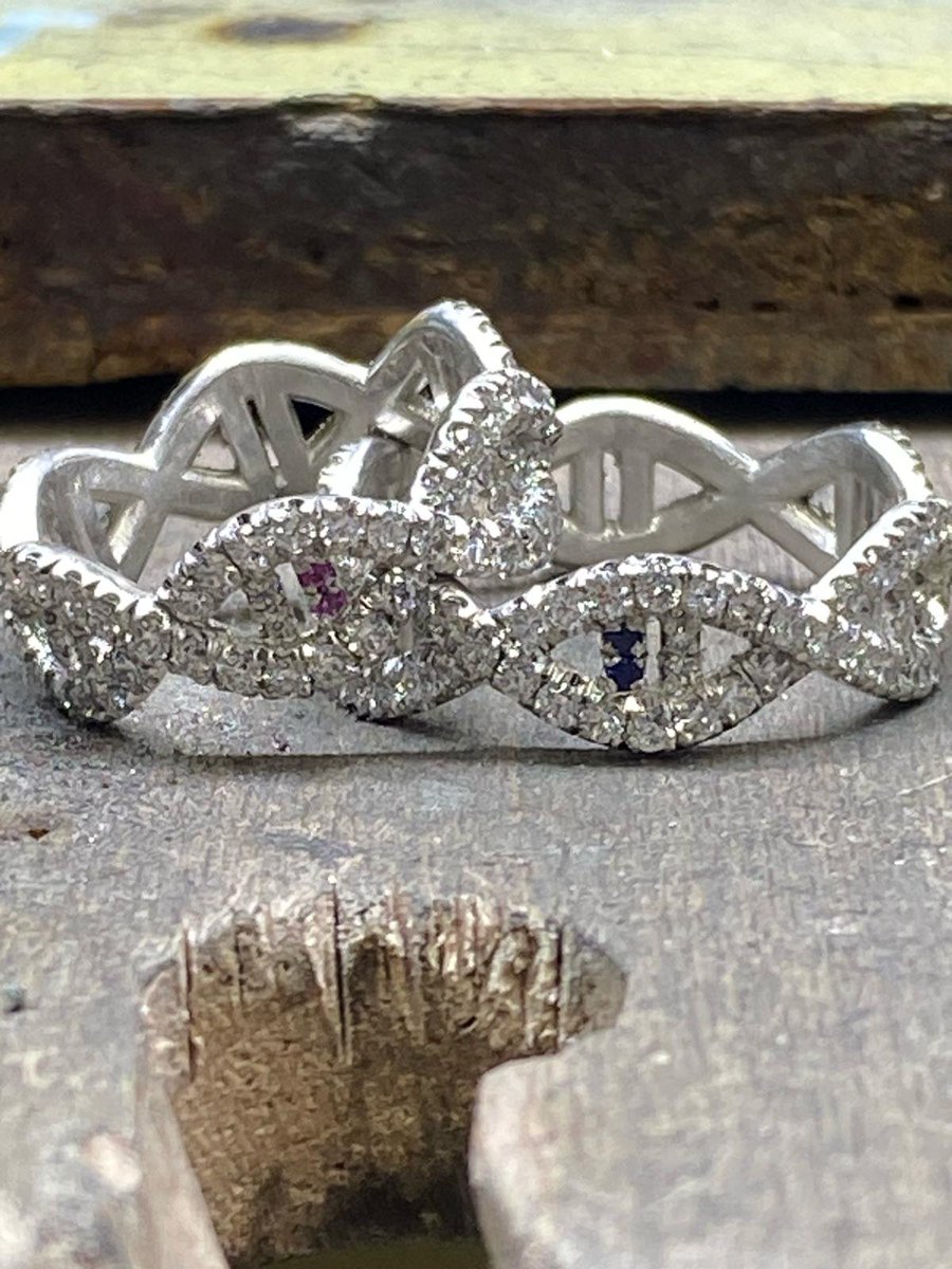 Selling two diamond DNA double helix rings