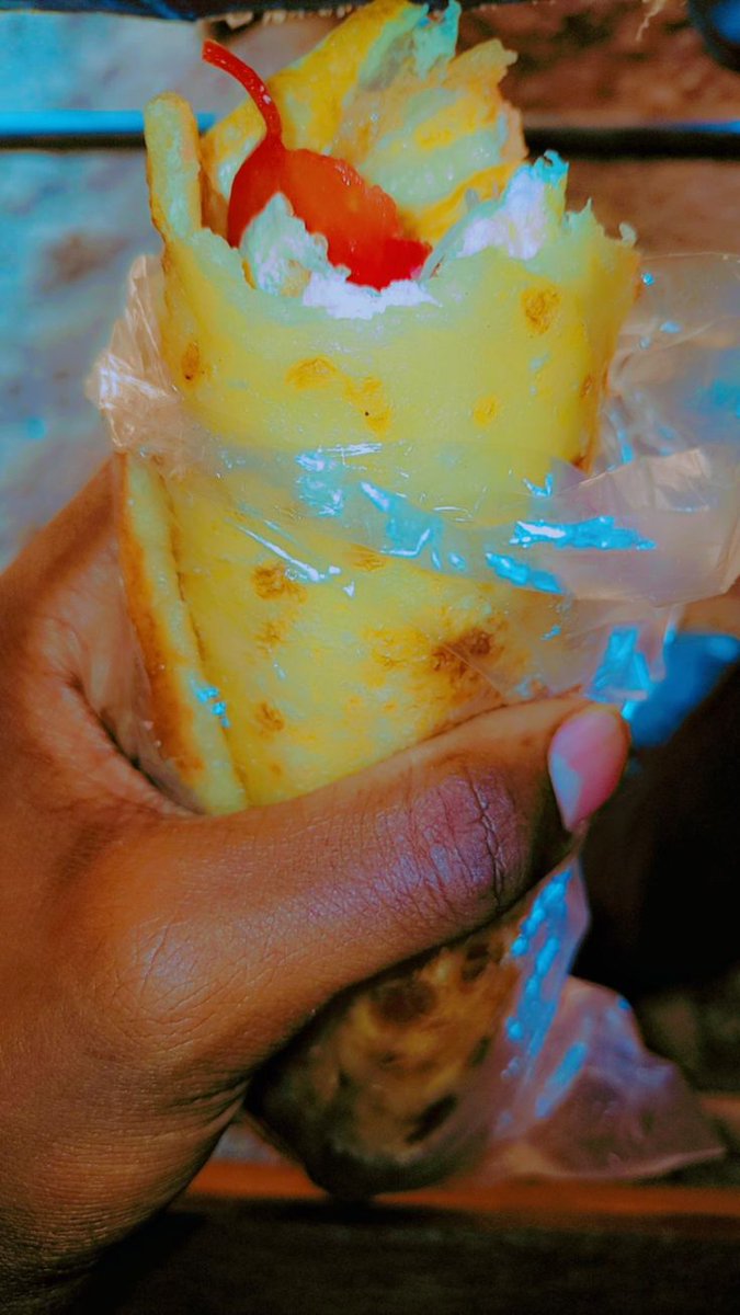 Rolex, Uganda's favorite street food! This delicious chapati-wrapped omelette is a staple in Kampala's streets. Who's craving a tasty Rolex? #GoldenPosts #RolexLove #UgandanFood