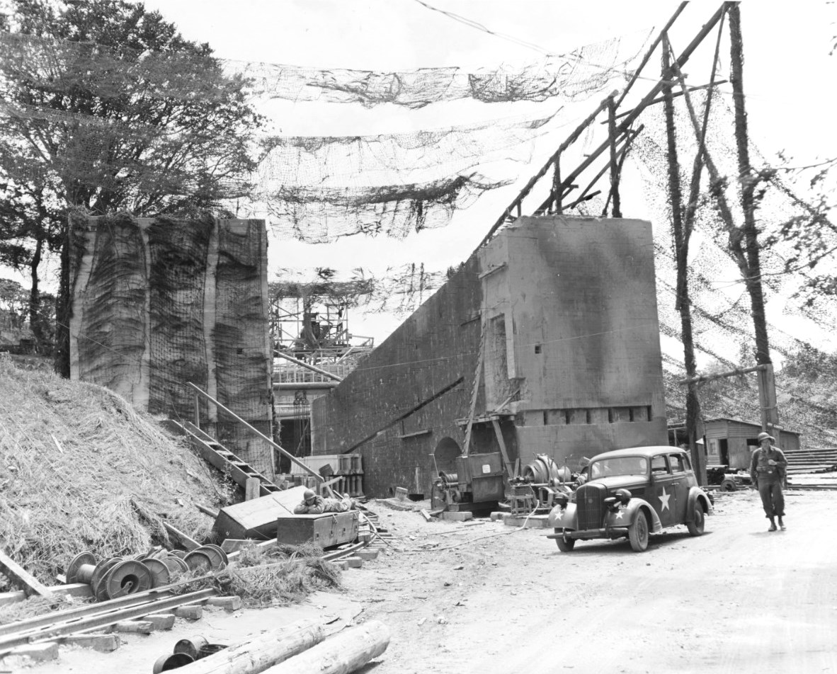 US Army personnel inspect an abandoned partially completed V-1 launching ramp near Cherbourg, France, 12 Jul 1944.