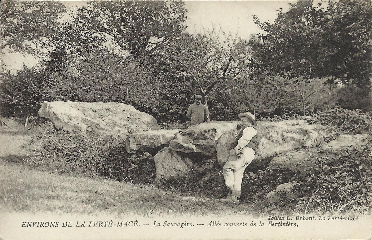 PhilWat09037421's tweet image. The allée couverte of La Bertinière (aka Grotte des Fées) in La Sauvagère (Orne) is nearly 15m long and has 9 capstones on 18 orthostats. This card by L. Orhant in La Ferté-Macé c. 1918 shows the front section and first 5 capstones.