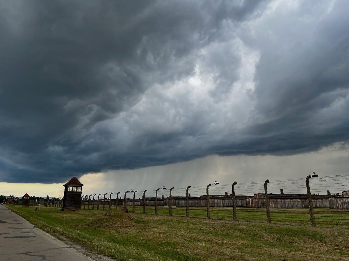 Auschwitz II-Birkenau site. The outside barbed-wire fences of the BII sector and wooden barracks for prisoners at the men’s quarantine section (BIIa). The camp was surrounded by a single row of barbed wire installed on concrete posts. The voltage in the fence was 760 Volt.