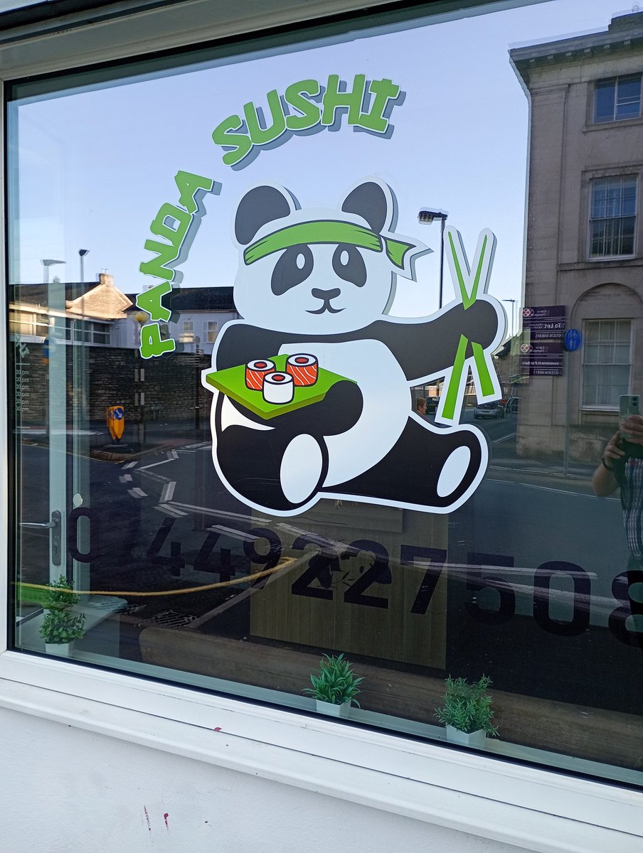 Is this panda carrying sushi or toilet rolls?