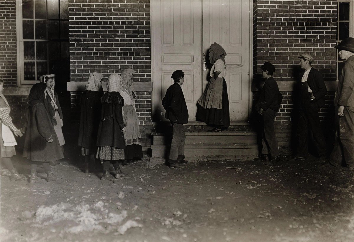 In Dec 1908, Lewis Hine captured children in Whitnel, North Carolina, heading to a 12‑hour night shift (6 PM–6 AM), many under 12, drenched and underclad, earning just 84¢ a night. His photo helped spotlight such exploitation