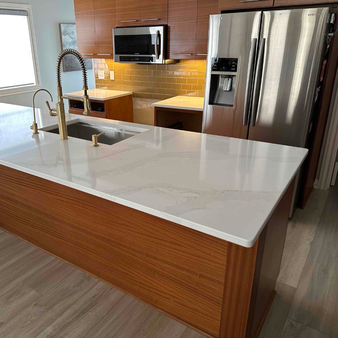 Warm wood cabinets meet crisp white quartz and elegant gold fixtures—timeless style with a modern touch. ✨

What do you think of this kitchen update? Let us know in the comments!

#KitchenDesign #QuartzCountertops #MKDKitchenandBath