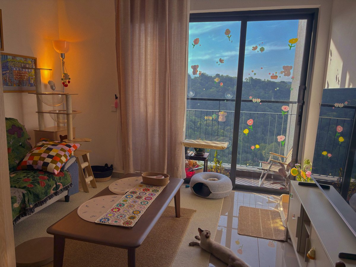 I added window stickers and my living room is so cute in the morning!