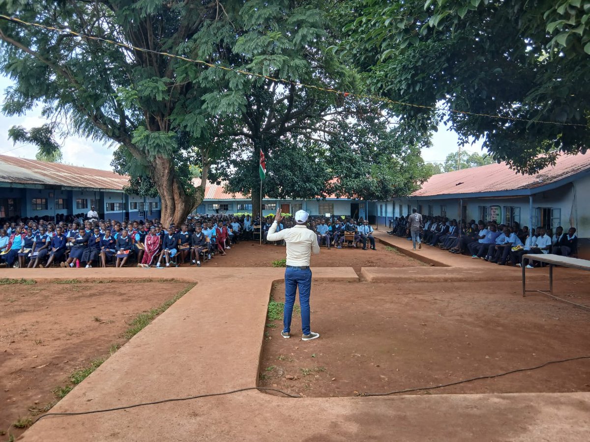 The initiative aimed to empower students through mentorship, promote environmental conservation through tree planting, and address menstrual hygiene challenges by donating sanitary pads to girls.