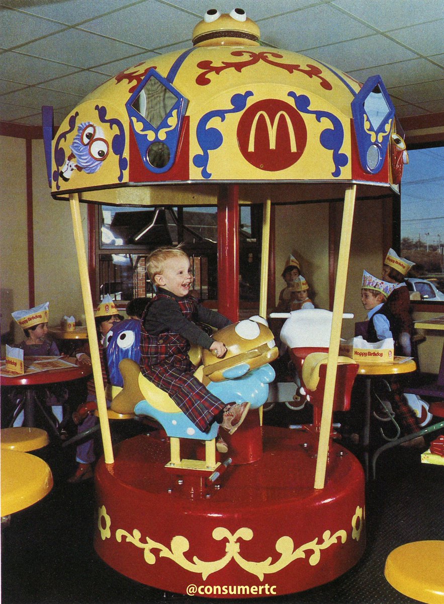consumertc's tweet image. Crazy to imagine a time when McDonald's would have a legit CAROUSEL in the middle of its restaurant. This kid is having the time of his life riding that Filet-O-Fish.