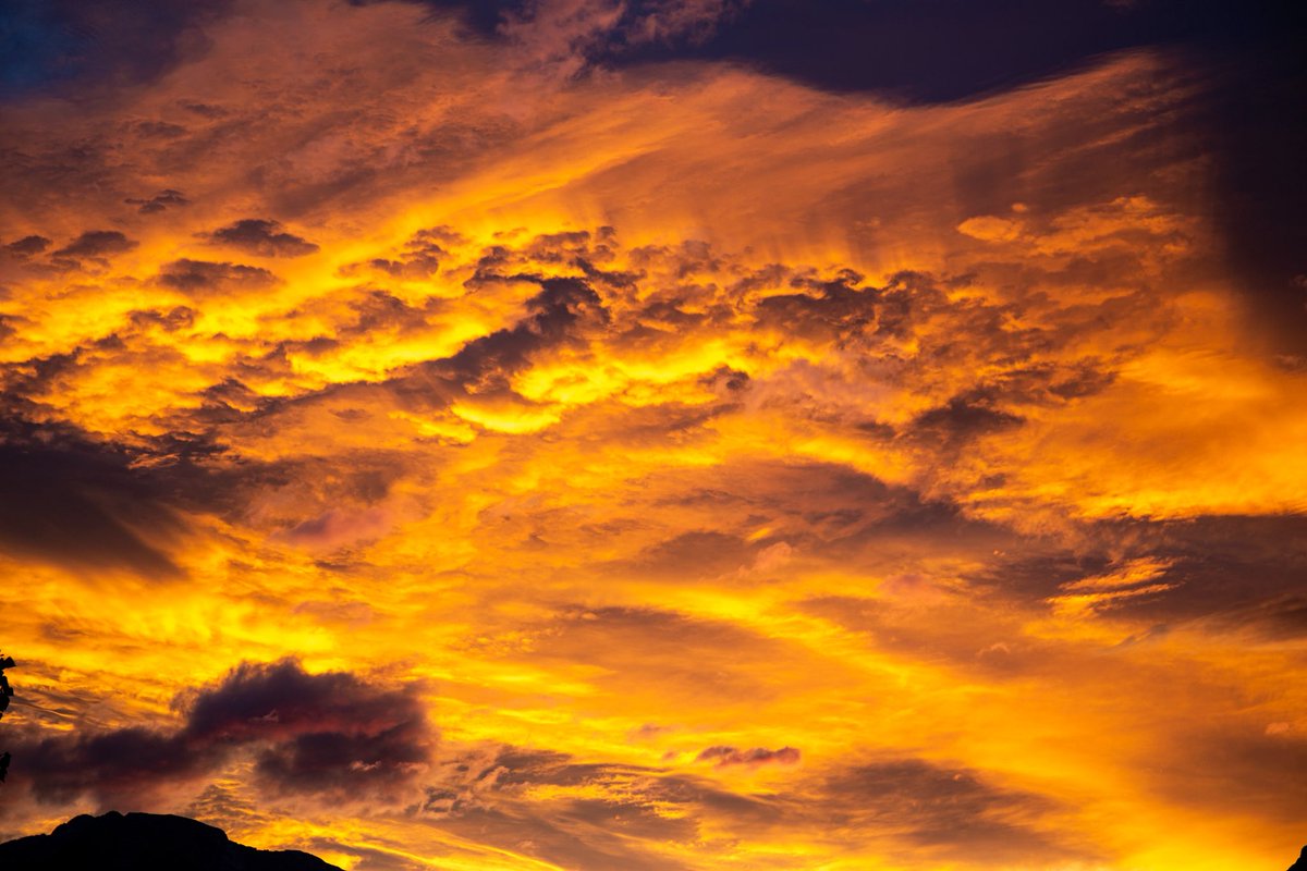 There is evening and there is morning, the next day. #canmore #ShareYourWeather #abstorm. A very colourful sunrise this morning, 07/13/25 5:35. A pleasant temperature of 15 C. Cloudy. There was some interesting whispy structure in the clouds. Over Grotto Mountn and Lady MacDonald