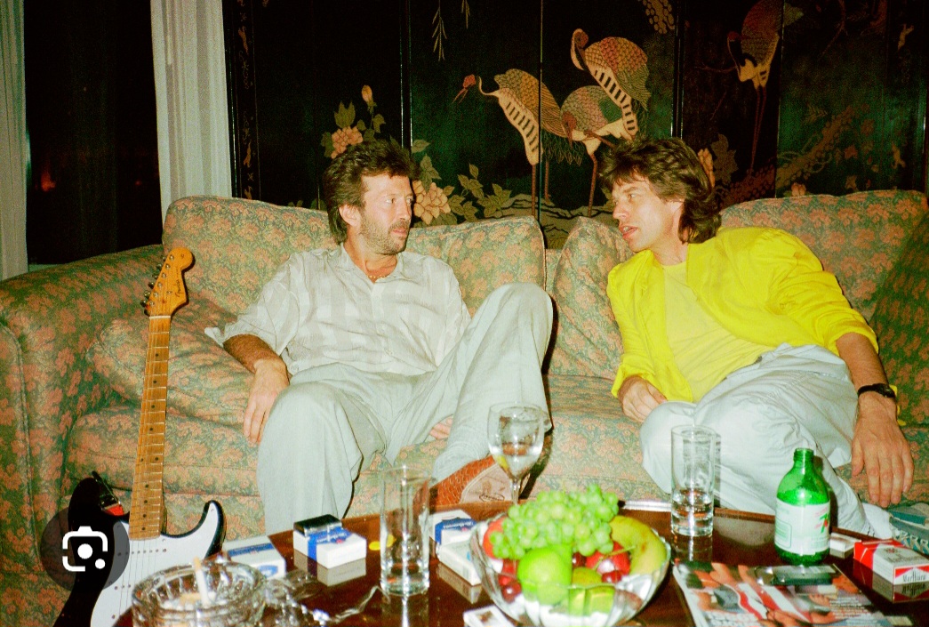 thepattieboyd's tweet image. 40 years since Live Aid this weekend, wow!
I took this picture of Eric and Mick the night before the show in Philadelphia.
We checked-in to the Four Seasons Hotel, I believe, and Mick came to our room for a chat.
@EricClapton @MickJagger #LiveAid40