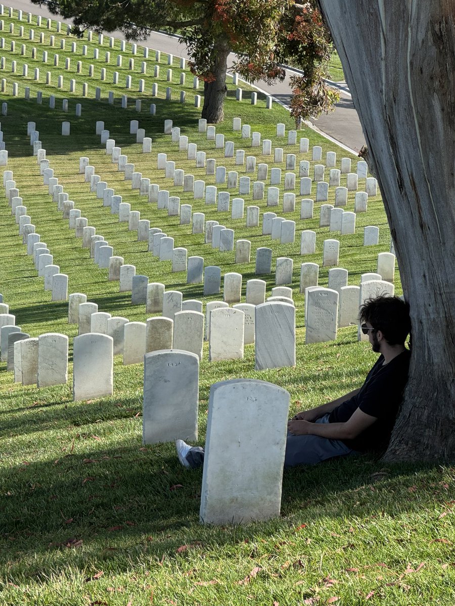 Fort Rosencrans National Cemetery in San Diego, Calif. on the Point Loma Peninsula. It was one of seven national cemeteries created between world wars, 1934–1939. Over 120,000 are buried/interred here. That’s my son sitting under the tree.