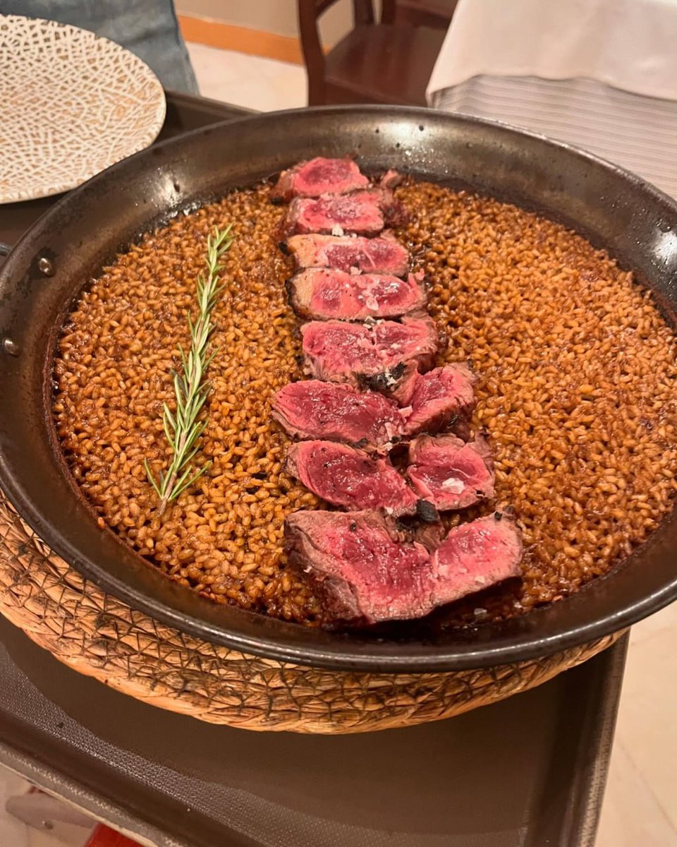 Sizzling steak perfection atop a bed of savory grains!  #Foodie #SteakNight