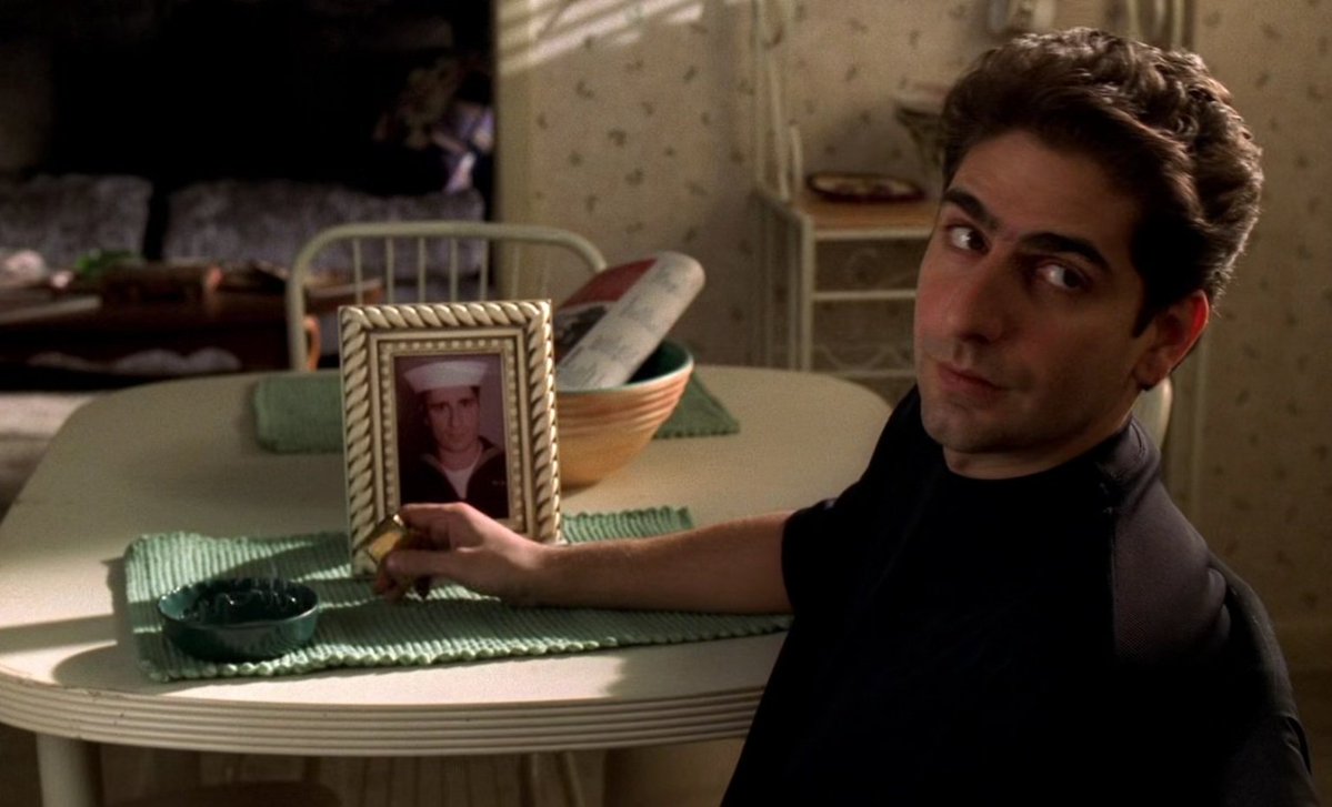 pityforyourself's tweet image. In the episode "For All Debts Public and Private" Christopher is looking at pictures of his father Dickie. One of them is actually a young Michael Imperioli and his dad, and the other is Michael's brother. They had him come to the studio and put on the sailor outfit.