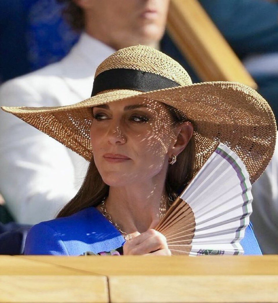 MonPetitChou11's tweet image. The sun is creating a lacy pattern on the Princess of Wales’ face (Wimbledon 2022 & 2025)—she is a piece of art.