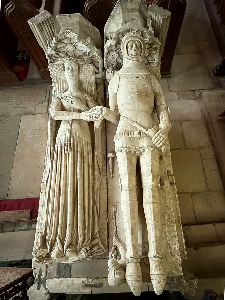 Handholding tomb of Ralph Green d.1417 and his wife Katherine. Made of alabaster in 1419 in Chellaston, Derbys at a cost of £40.  Somewhat bashed about and I think that her hand has been remodelled. A beautiful piece.  Lowick St Peter, Northants.