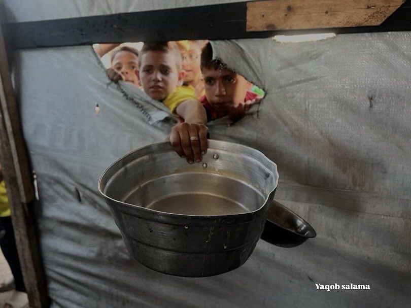 EyeonPalestine's tweet photo. A child breaks down in tears while trying to secure a meal in one of the aid distribution lines.

Amid blockade and famine, survival has become a daily battle, forcing children into a harsh fight for a single bite. https://t.co/aFqUzkA06F