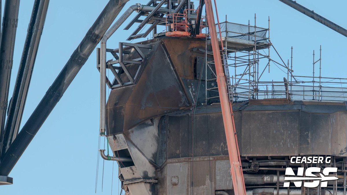 SpaceXNewsTX's tweet photo. UPDATE: The new Ship Quick Disconnect (SQD) is being assembled directly on top of the BQD hood at Pad 1. This setup will support future Ship static fires until the Massey test site is back online.
#Starbase #SpaceX #ShipQD #Pad1 https://t.co/j90oEBpPsT