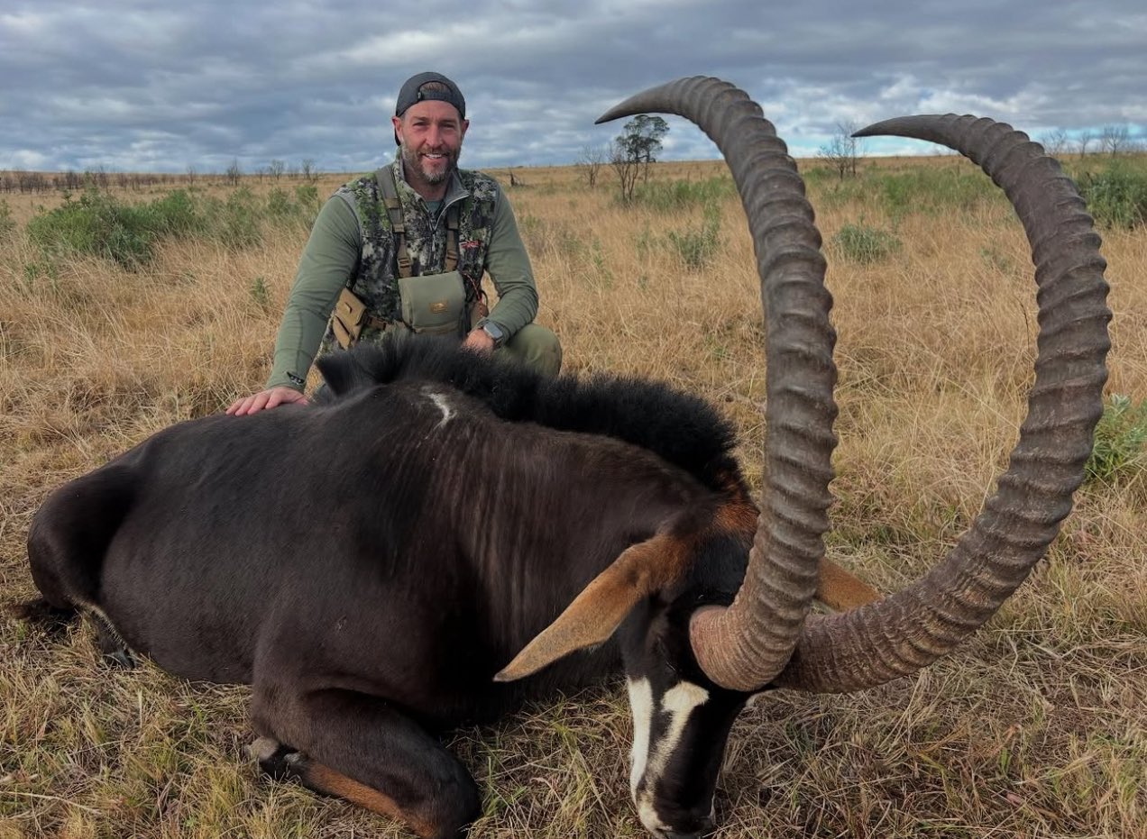 Former NFL Quarterback Jay Cutler posing over a Giant Sable Antelope - Via ML Football