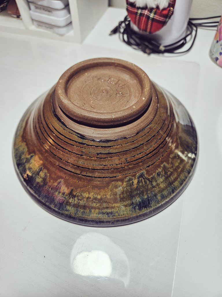 My neighbor is an artist. He does pottery, paints, sculpts, and does photography. He made this beautiful bowl just for me! I think it's gorgeous; the colors are amazing. It has a lot of iridescence that doesn't show in the pictures. I love it!

We have such great neighbors.