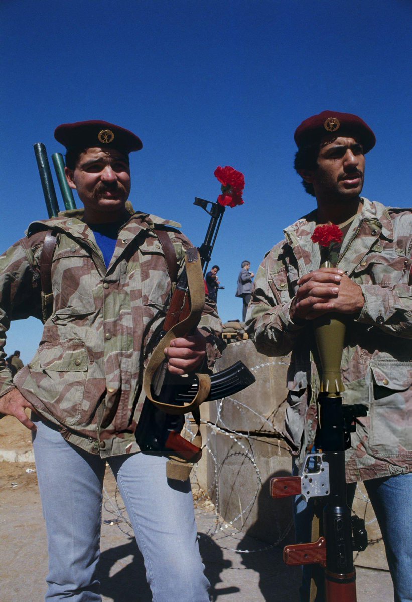 Druze Militiamen (wearing surplus west german splintertarn) watch and guard the evactuation of American, European and other foreign civilians who are being ferried by US military helicopters to ships off the coast of Beirut on their way to Cyprus
