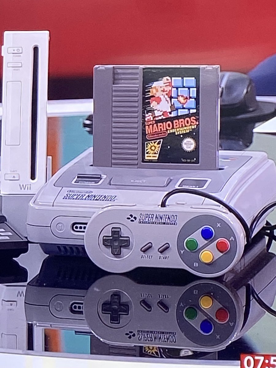 Why does a retro games expert have a NES game stuck in a Super NES on #bbcnews?
