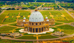 aomenya's tweet image. Côte d'Ivoire President Houphouët-Boigny built the biggest basilica in Africa,at his birthplace, Yamoussoukro. Same period, in Romania, Nicolai Ceausescu was building the Palace of the Parliament in Bucharest. Dictators don't develop people, they stage manage grand spectacles.