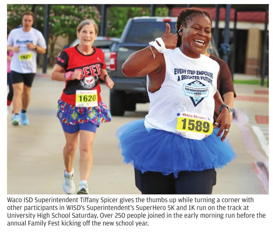 Waco ISD Superintendent Tiffany Spicer gives a thumbs up 👍 while participating in the Superintendent's Superhero 5K 🏃‍♀️, an event that she is passionate about ❤️. Dr. Spicer emphasizes the importance of staying healthy 🌟 while having fun 🎉. This photo was taken by Rod Aydelotte